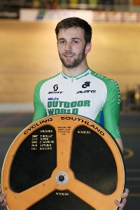 Tom Beadle with the Cycling Southland Wheelrace Trophy